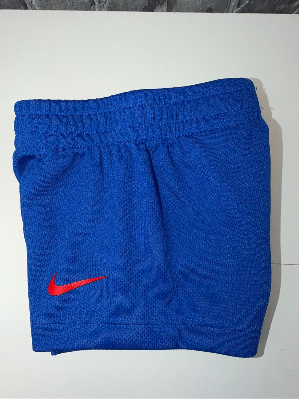 Nike Kids Blue Athletic Shorts with Red Swoosh